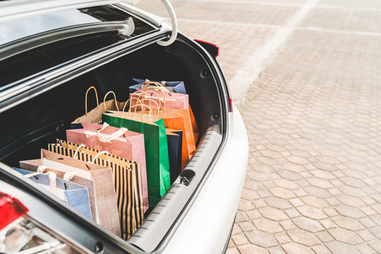 Shopping Bags In Car Trunk Or Hatchback, With Copy Space. Modern Shopping Lifestyle, Rich People Or Leisure Activity Concept