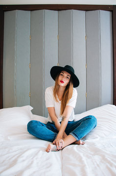 Portrait of beautiful young woman with hat