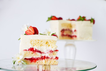 A piece of yoghurt cake with strawberries