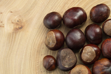 Group of chestnuts in a wooden background