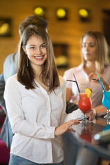 Beautiful young woman at coctail party