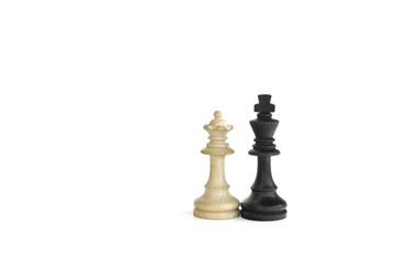 White queen and black king, traditionally confronted in chess game, are together. Image in isolated white background
