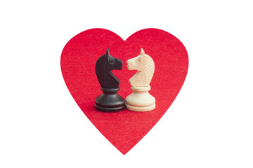 White horse and black horse, traditionally confronted in chess game, have reconciled. Image in...