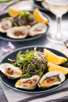 Grilled Oysters with Herb Butter Sauce