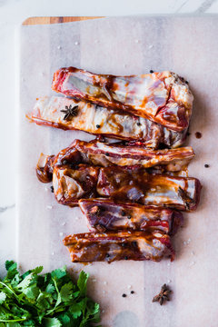 lamb ribs marinating in a hoi sin sauce, with coriander, star anise, pepper and salt