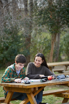 Young couple of students together at the campus of the university