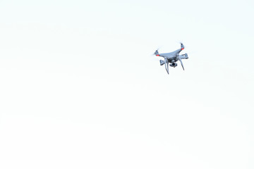Drone being piloted high in the sky