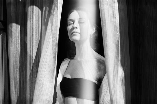 A black and white film portrait of a young beautiful  woman