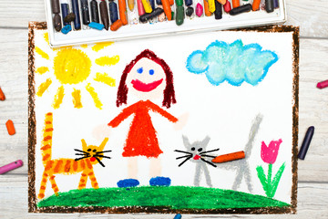 Obraz na płótnie Canvas Photo of colorful drawing: Smiling little girl and her cute cats