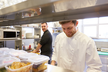 Fototapeta na wymiar chef and cook cooking food at restaurant kitchen