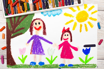 Fototapeta na wymiar Photo of colorful drawing: Happy single mother with her daughter