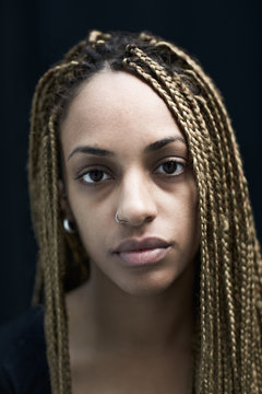 Portrait Of Young African American Woman With Braided Hair