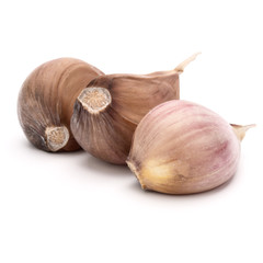 Three garlic cloves isolated on white background cutout