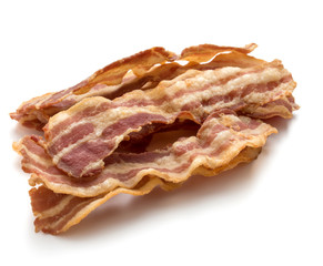 cooked crispy slices of bacon isolated on white background