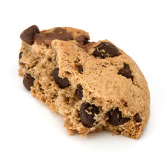 One broken Chocolate chip cookie isolated on white background. Sweet biscuit crumbs. Homemade pastry.