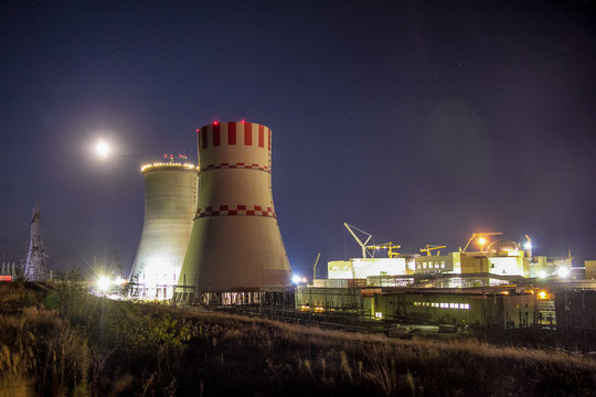 Night view of construction site of new building nuclear power plant