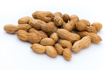 Dried peanuts on the white background.