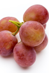 Ripe red grape isolated on white.