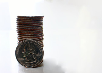 US Dollar coins, white background as well-being in business