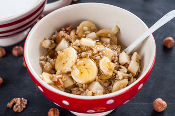 Healthy breakfast, oatmeal, banana, pear, honey, flax seeds, chia seeds