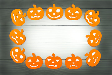 Round frame with different pumpkin paper silhouettes