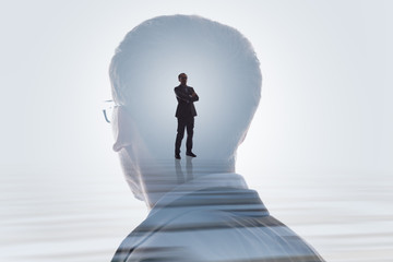 Double Exposure Of Businessman And Cityscape