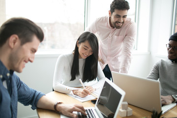 Young professionals working on laptops in an office