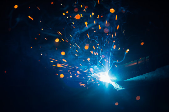 artistic welding sparks light, industrial background