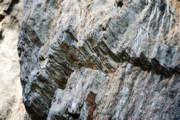 Rock of slate, the structure of the stone is a complex relief.