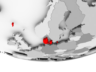 Map of Denmark on grey political globe