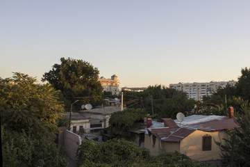 Obraz premium City slums smoothly pass into a modern city. Taskent.