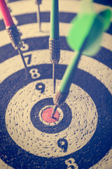dart arrow hitting in the target center of dartboard,abstract of success - 172908696