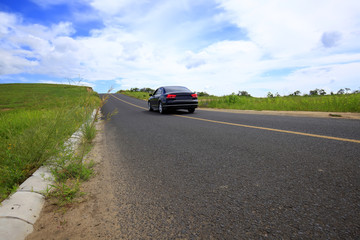 Plakat asphalt road on grassland
