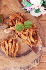 Fried fish is tasty on wood background