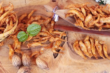 Fried fish is tasty on wood background