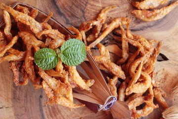 Fried fish is tasty on wood background