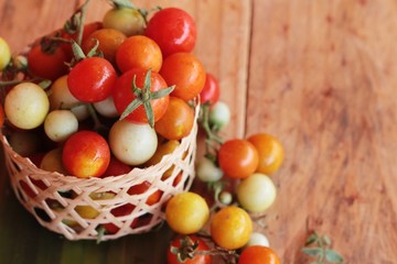 Fresh tomatoes for cooking on wood background