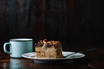 Bread pudding with caramel sauce served with a cup of hot cocoa