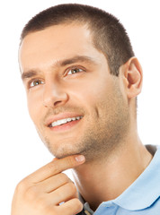 Obraz premium Cheerful thinking young man, over white