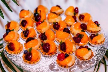 Tasty sweet snack, tangerine and various fruits