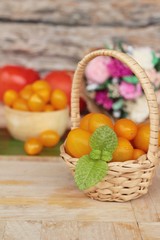 Fresh yellow tomatoes organic on wood background