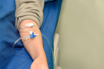 saline intravenous or iv solution with patient arm