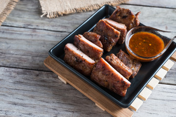 Grilled barbecue pork ribs on plate table background