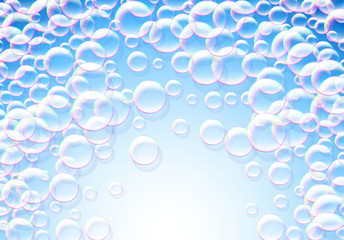 Soap bubbles abstract blue background with rainbow colored airy foam
