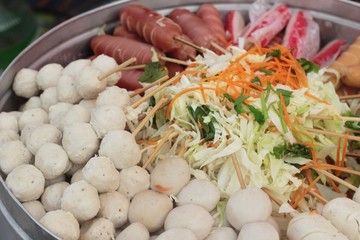 Meatballs and sausages steamed in the market