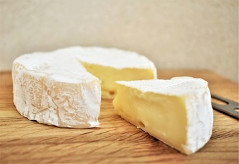 Fototapeta na wymiar Camembert cheese sliced, closeup.