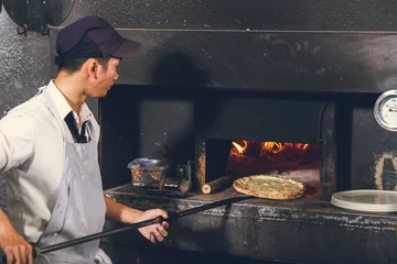 Wall murals Pizzeria Baking pizza in oven