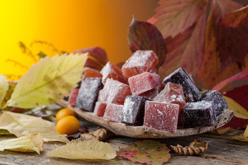 Homemade marmalade and autumn leaves.