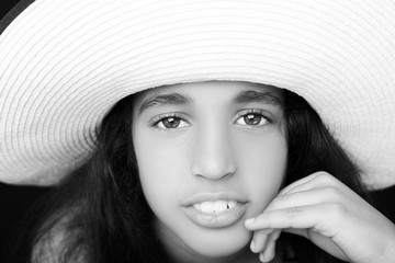 Portrait of a young african american girl  with sun hat