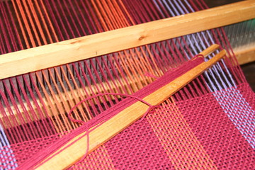 looms, loom fittings, woven scarves, colored yarns white backgrounds